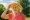 old woman enjoying summer after taking magnesium supplements