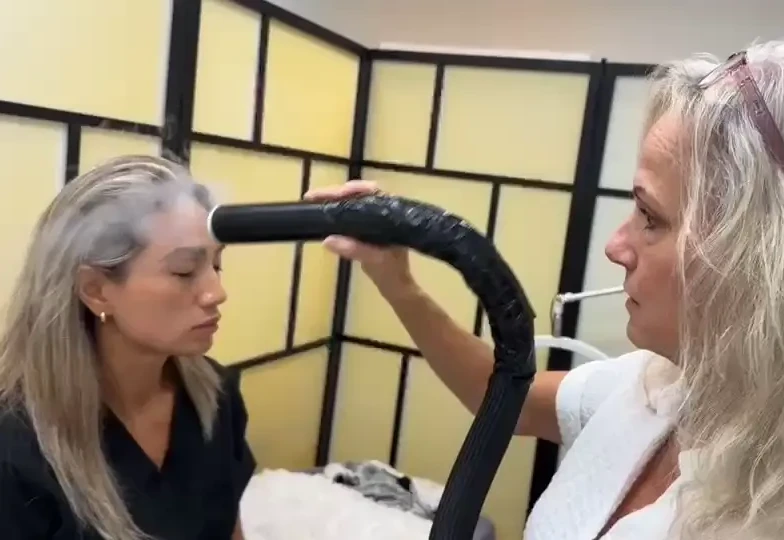 cryotherapist Amy doing cryofacial cryotherapy at wellness revolution texas